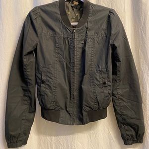 Black fitted zip up sport jacket.